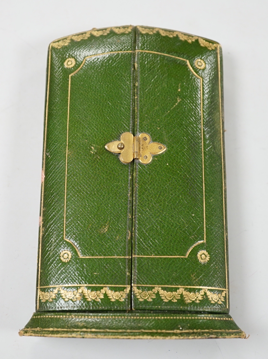 A 1920's? Cartier gilt tooled green leather free standing jewellery box, height 14.2cm